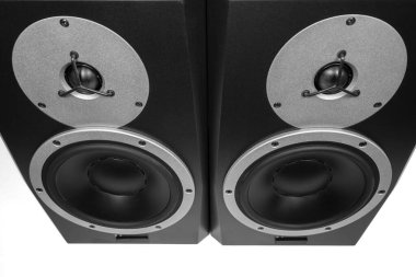 Two black audio speakers and studio monitors, musical equipment.