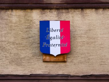 Colmar, France - March 27, 2022: Coat of arms in the colors of the French flag with the motto of the French Revolution: Liberty, Fraternity, Equality