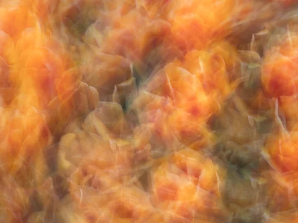 意図的なカメラの動きで作成された鮮やかなオレンジ色の抽象的なパターンは ユニークで魅惑的な背景を作り出します — ストック写真