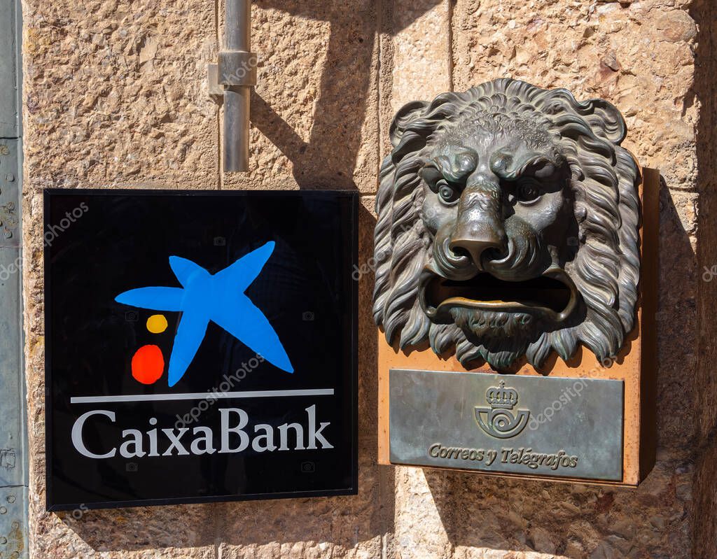 Montserrat, Spain - October 8, 2023: Branch of CaixaBank in Montserrat, with administration in Barcelona and legal headquarters in Valencia, is leading spanish retail bank