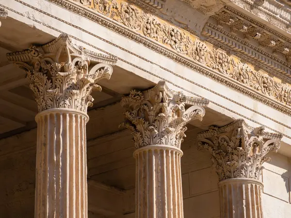 The columns of the antique Roman temple Maison Carree in city of Nimes in southern France