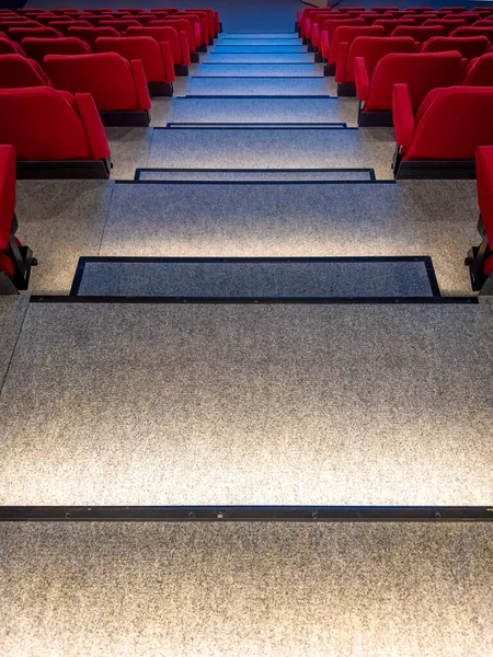 Empty cinema hall with red seats- movie theater