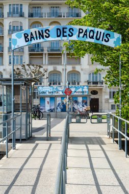 Geneva, Switzerland - April 5, 2024: The Bains des Paquis is a public bathing establishment and an architectural monument on the shores of Lake Geneva. clipart