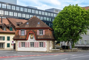 Olten, Switzerland - April 26, 2024: The old historic Restaurant Zollhaus stands out among the more modern buildings in Olten, swiss canton Solothurn clipart