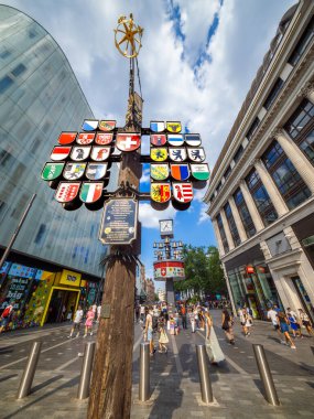 London, United Kingdom - June 25, 2024: Swiss Court area in London with cantonal tree displaying coats of arms of all swiss cantons clipart