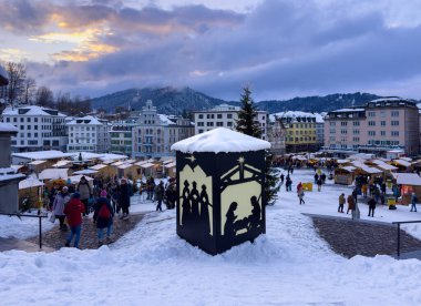 Einsiedeln, Switzerlan - December 5, 2023: Christmas market in Einsiedeln, a village in the Swiss canton of Schwyz. It is known for the Monastery, the most important baroque building in Switzerland clipart