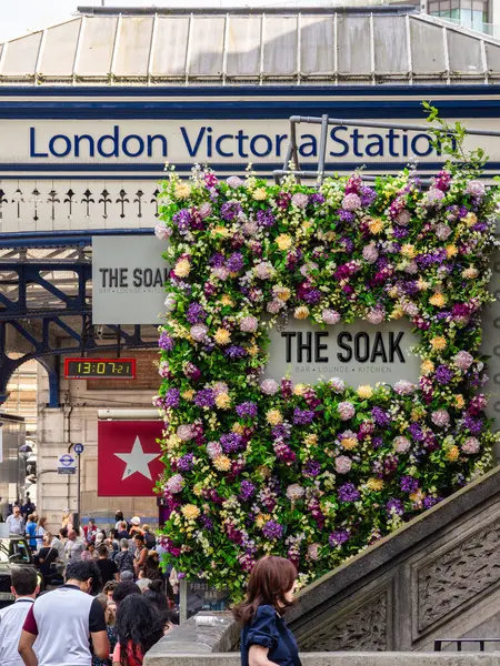 Stock image London, United Kingdom - June 25, 2024: The Soak at London Victoria station is a contemporary bar and restaurant known for its modern British cuisine, vibrant atmosphere, and extensive drink selection