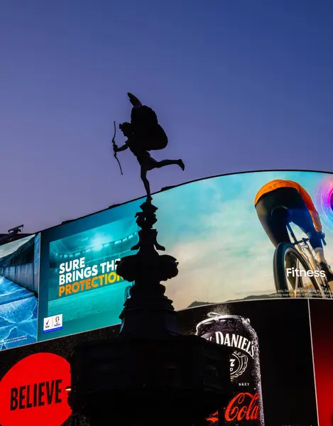 stock image London, United Kingdom - June 25, 2024: Iconic Eros statue at Piccadilly Circus, London, amid dazzling billboards at night.