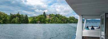 Halbinsel Au, Switzerland - July 1, 2024: Halbinsel Au is a picturesque peninsula located on the shores of Lake Zurich in Switzerland. clipart