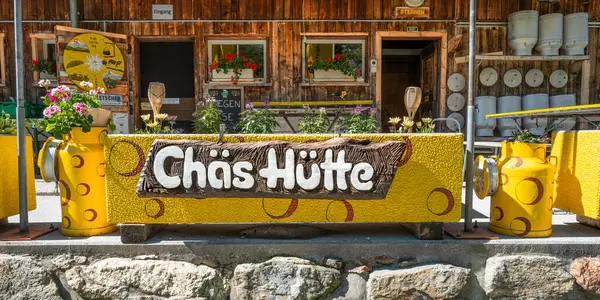 stock image Sustenpass, Switzerland - July 5, 2024: Traditional mountain hut and Alpine Swiss cheese shop at Susten pass