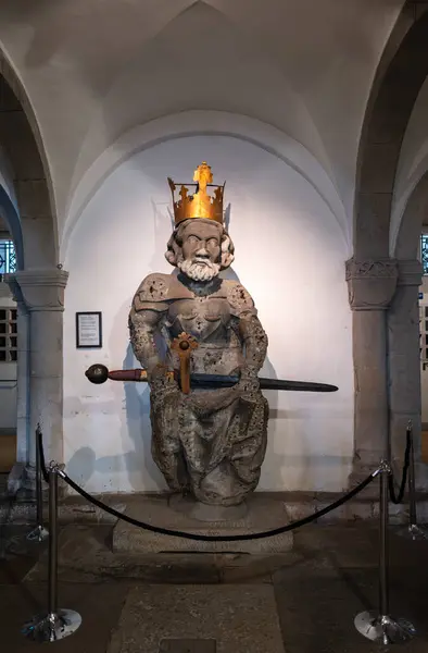 stock image Zurich, Switzerland - July 1, 2024: Medieval statue of Charlemagne royal figure on throne in the Grossmunster church in Zurich.