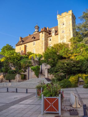 Montlucon, France - July 18, 2024: Montlucon medieval Castle at the golden hour of the day before sunset clipart