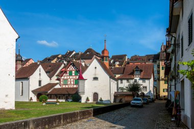 Bremgarten, Switzerland - August 3, 2024: Townscape view of historical Bremgarten with traditional architecture and a small chapel. clipart