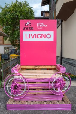 Livigno, Italy - July 8, 2024: Livigno Citta di Tappa 2024 refers to Livigno, a picturesque town in the Italian Alps, being designated as a stage city for the Grand Tour of Italy clipart