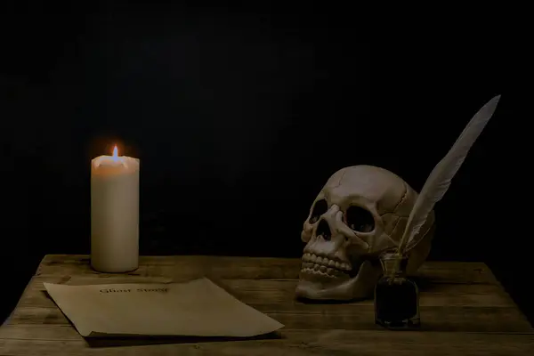 Start of a ghost story with parchment and quill .