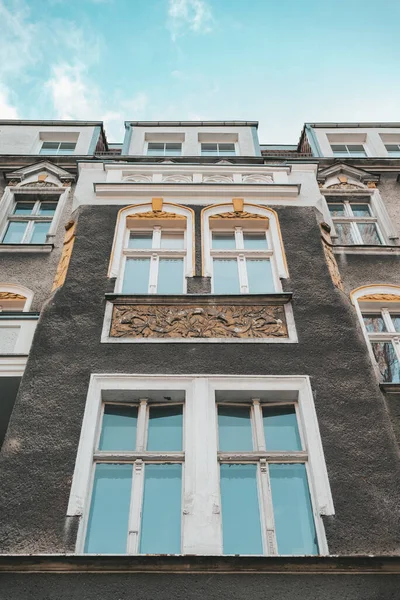 stock image old architecture and building in front of the facade of the apartment.