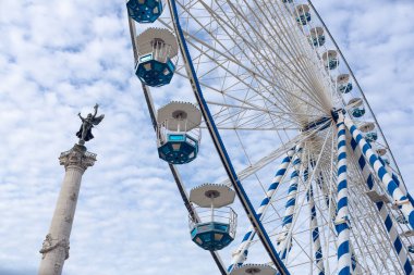 Bordeaux, France - January 14, 2023: Detail of the Ferris wheel installed next to the monument to the Girondins, in the Quinconces square in the city of Bordeaux, France