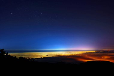 The starry night with the mist covering the mountains