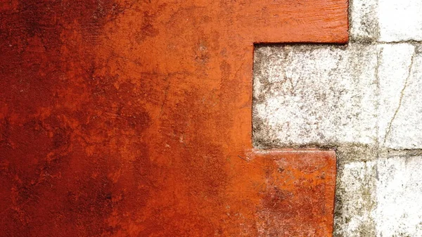 Arka Planda Taşlar Olan Kırmızı Duvarın Köşesi — Stok fotoğraf