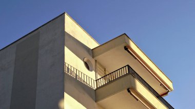 angle of facade of building with balcony against the sky