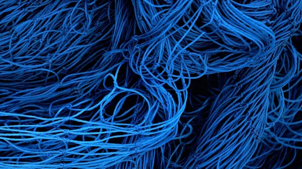 abstract background of blue net threads stacked as a background