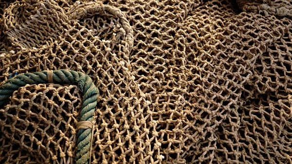 stacked rustic fishing net texture as background