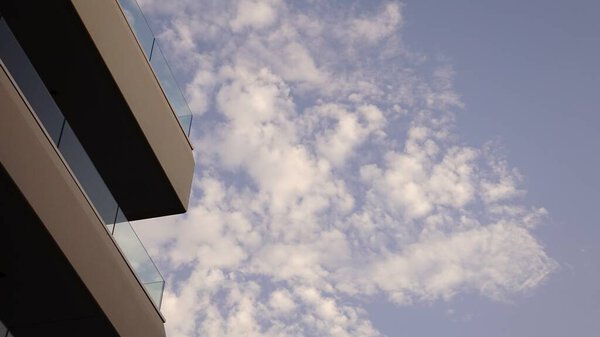 Modern building balconies against blue sky