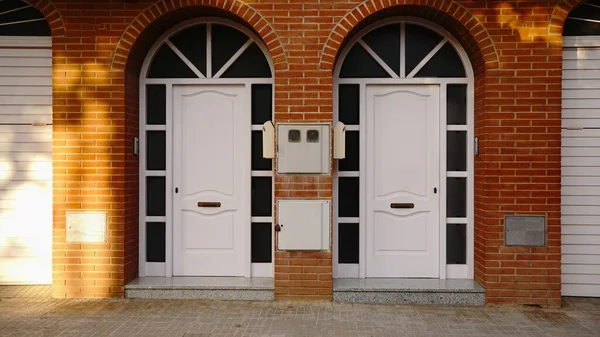 Red Brick House Facade White Access Doors — Stock Photo, Image