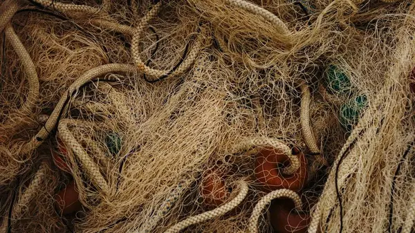 fishing net texture with ropes and buoy as background