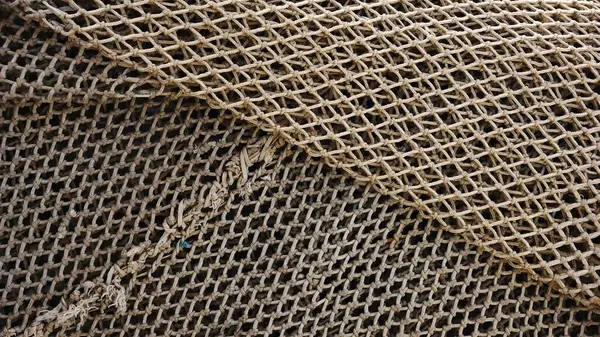 Texture of rustic fishing nets as a background