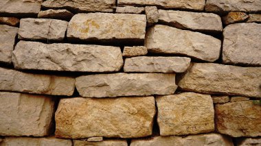 Yığılmış dikdörtgen kırsal taşların soyut arkaplanı