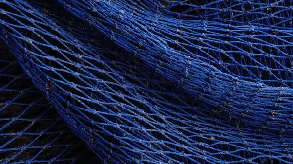 mavi balıkçı ağı arka plan olarak dalgalanıyor