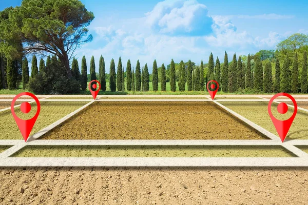 Land plot management - real estate concept with a vacant land on a plowed agricultural field available for building construction against a rural scene with trees on background