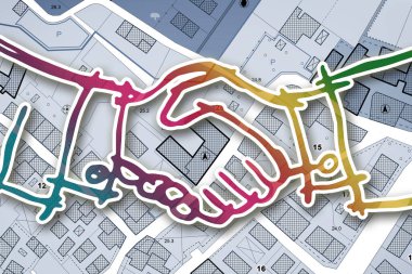 Handshake against an imaginary cadastral map of territory with buildings and land parcel - real estate and building activity agreements, cooperation, partnership and business clipart