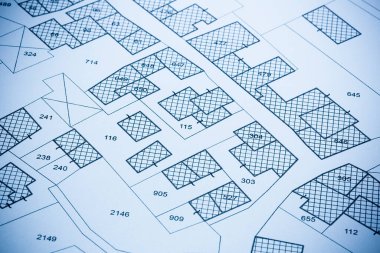 Imaginary cadastral map with buildings, land parcel and vacant plot printed on pape