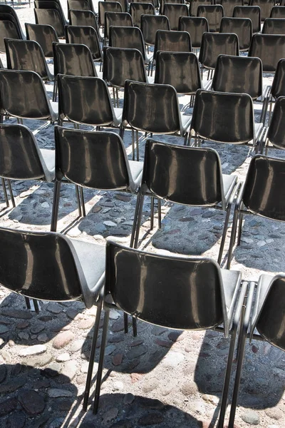 Outdoor cinema with plastic chairs in a row - image with copy space.