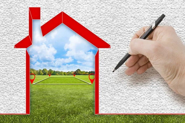 Buildings energy efficiency concept with home covered with polystyrene according to the new European law with vacant land in a rural scene on background