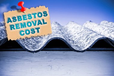 Asbestos removal cost concept with text against a dangerous asbestos roof 