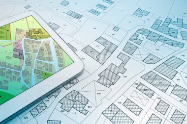 Buildings Permit concept with imaginary cadastral on digital tablet - building activity and construction industry with General Urban Plan