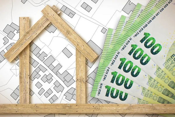 Costs about wooden buildings construction - build your comfortable home with natural materials and sustainable resource - responsible business concept with European euro banknote