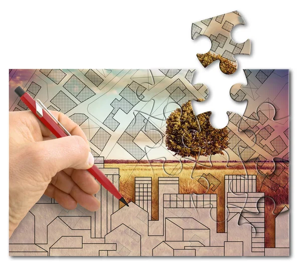 Architect drawing a new city with a city map against a rural scene with a lone tree - solution concept in jigsaw puzzle shape