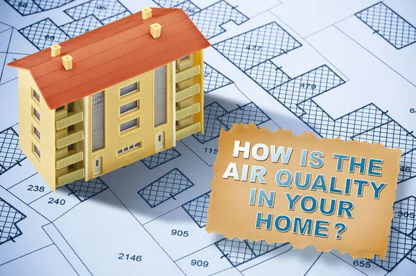 HOW IS THE AIR QUALITY IN YOUR HOME? - indoor air quality concept condominium residential building model in a cadastral ma