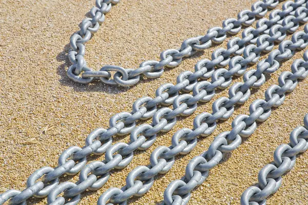 New galvanized metal chain placed on the ground