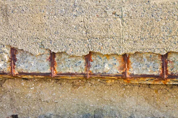 Poor and damaged concrete cover and corrosion of reinforcement bars with oxidation - fragments of concrete are detached from the concrete mass