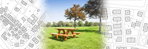 Wooden picnic table on a green meadow of a public park with trees against an imaginary city map with recreation areas, green spaces for leisure activities and municipal services