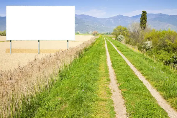 Blank advertising billboard immersed in a rural scene - image with copy space