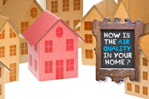 HOW IS THE AIR QUALITY IN YOUR HOME? - concept with home icon, wooden sign and text 
