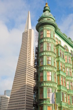 Transamerica Pyramid  - the modernist skyscraper in San Francisco near a Victorian style skyscraper - California - USA clipart