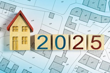 2025 BUILDING ACTIVITY AND CONSTRUCTION INDUSTRY HOUSING CONCEPT - 2025 Real Estate and Homeowner Association development concept with residential home model and cadastral map clipart