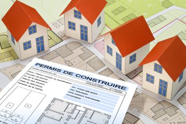 Building permit concept written in French - PERMIS DE CONSTRUIRE - Building activity with vacant land - Construction industry with a cadastral map, General Urban Planning and zoning regulations   clipart